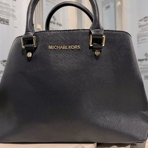 Navy blue Michael Kors handbag.